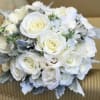 White roses, white lisianthus, dusty miller, white stock, silver dollar eucalyptus, baby&#039;s