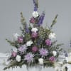 Lovely lavender roses and spider mums with purple larkspur and white carnations