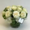 Exquisite white Mondial roses with hydrangea and aspidistra leaves