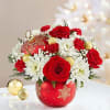 EXCLUSIVE Our floral designers have handcrafted an arrangement of roses, poms, carnations