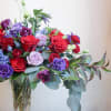 The Bucktown Garden features a rich palette of deep jewel-toned florals, and