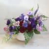 This arrangement of jeweled-toned arrangement makes a gem gift for any occasion