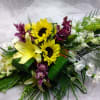 This beautiful centerpiece is absolutely perfect for any occasion. Designed using sunflowers