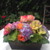 Combination of bright roses, variety of succulents, Orchids, colorful Hydrangeas and exotic