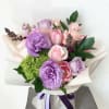 Mixed bouquet of pink Roses, lavender Lisanthus, lavender and peach roses, lavender
