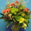 A mixture of fall colored spray roses, alstroemeria, solidago, pomps, thistle and