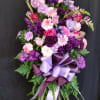 A beautiful tribute in purples and lavenders. Stock, Glads, Carnations, Roses and