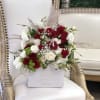 This Chocolato arrangement is made with Red and White Roses with Pampas.