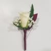 This creamy white rose is dressed with greens, baby&#039;s breath and burgundy