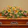 Pay your respects with a divine mix of pink and yellow blossoms
