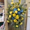 A beautiful blend of silk flowers in pale yellows, blues and greens
