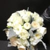 This bridal bouquet make with cream and white roses and dusty miller