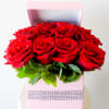 16 red roses in an elegant square gift box with jewel cuff