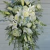 Soft blue and white arrangement on an easel is suitable for a