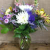 A lovely mixed bouquet with large vibrant white flowers