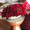 For the show stopper! This chic, lush display of roses, and tropical