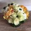 This is a lovely, modern arrangement with a mix of seasonal flowers