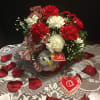 Fresh mixed flowers with small plush