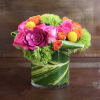A fun and cheerful arrangement of hot pink and orange roses, yellow