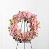 The FTD Loving Remembrance Wreath is a blushing display of grace and