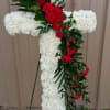 white cross with a splash of red