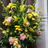 Basket of yellows and a touch of pink