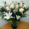 White, purple, and ivory flowers artfully arranged in a premium purple ombre