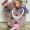 Welcome a baby girl with a basket full of goodies......books, blanket, stuffed
