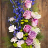 Our artisan handmade arrangement's overall theme is different shades of Spring The