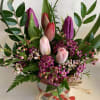 Beautiful tulips arranged in a decored hearts pot, very cute! 