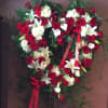 Red roses, white lilies, white hydrangea, calla lilies and assorted greenery