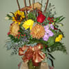 Festive bronze and rust Mums, Sunflowers, Roses with Eucalyptus and Cattail accents