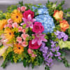 A bright, bold, and uplifting casket tribute . For a true celebration