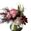 An original arrangement consisting of soft pink Roses, dark pink Tulips, white/pink