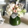 The perfect dinner party centerpiece trio composed of antique-white Dahlias and Hydrangeas