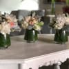 The perfect dinner party centerpiece trio composed of antique-white Dahlias and Hydrangeas