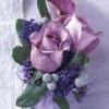 A beautiful bunch of lavender roses with texture accents. 