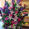 Gladiolas, carnations and Roses and other fillers to allow to give this