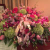 Large kiwi green hydrangea, purple orchid, purple roses, light pink tulips, lavender