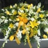 Yellow lili, white mini calla lili, bright yellow roses, white orchids and