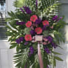 Pink gerbera daisies, white snap dragon, purple stock, liatris, white filler and
