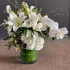 White casa blanca lilies, hydrangeas, roses, orchids, scabiosa, curly willows mixed with
