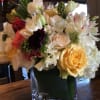 A mixture of roses, hydrangeas, sweet peas, lisianthus, anemone, hyacinth arranged in