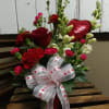 A Red Rose accompanied by White Snapdragons, Pink Mini-Carnations, Standard Carnations, Mixed