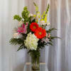 This gorgeous array of carnations, lilies and other favorites is a perfect