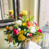 This large brightly colored arrangement is both rustic and elegant!  Surprise