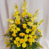 Bright yellow blooms of roses, gladioli, button mums, daisies and golden aster.