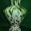 This mid century HAND BLOWN, ART GLASS VASE is a captivating blend