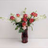 A beautiful medley of fresh and colorful roses hugging other beautiful flowers