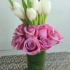 Super simple white tulips and roses  arrangement. Colors of flowers can